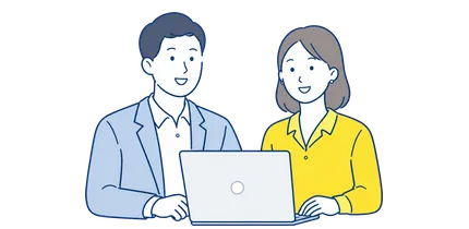 パソコンを囲んで相談するスタッフ